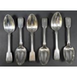 Six George IV silver fiddle back pattern dessert spoons, all engraved with a single indistinct