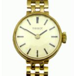 A vintage Tissot 9ct gold cased lady's wristwatch, ref. 1061, circular brushed silver dial with