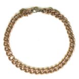 A 9ct yellow gold kerb link bracelet, each link hallmarked, with steel ring clasp and gold safety