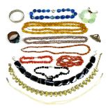 A group of costume jewellery, including a long amber necklace, a cultured pearl double strand