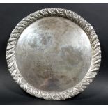 A 800 silver circular tray, with plain centre and gadrooned rim.