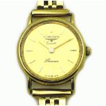 A vintage Longines Presence 9ct gold lady's wristwatch, circular gold dial with gold baton numerals,