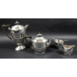 A George V four piece silver tea service, all with half reeded lower bodies, comprising a teapot