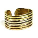 An 18ct tri-colour gold ring of open-backed design, a/f slightly bent, size M, 4.7g.