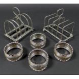 A group of Edwardian and later silver, comprising two silver toast racks, one Atkin Brothers,