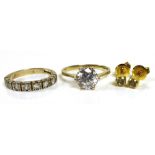 Two gold and white stone rings, comprising a 14ct gold ring set with a large white stone, size P/