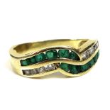 A 14ct gold, emerald and moissanite crossover ring, size K, 3g.