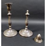 A pair of George III silver candlesticks, the slender knopped columns with fine reeded decoration,