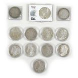 A collection of twelve 19th century and later silver US one dollar coins, including a run of coins