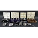A collection of Edwardian and later silver items, to include four cased sets of six teaspoons, two