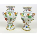 A pair of late 19th century Meissen porcelain vases, encrusted with flowers and fruit, a/f one