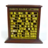 An Edwardian mahogany table top cabinet, advertising interest, for 'Cash's Double Letters',