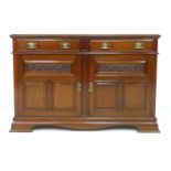 An Art Nouveau mahogany sideboard, with two drawers over two cupboards, a/f missing mirrored top,
