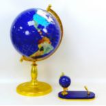 A semi-precious stone effect terrestrial globe, raised upon brass base, 29 by 56cm high, together