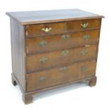 A 19th century mahogany veneered chest of two short over three long graduating drawers, with brass
