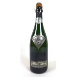 Vintage Champagne: a bottle of Champagne 'Gout de Diamantis', capsule and cage loose/damaged.