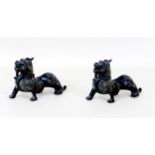 A pair of early 20th century Chinese cast bronze griffins, unsigned, with engraved decoration, 19 by