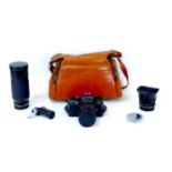 A Leitz Leica R4S SLR camera, fitted with a Leitz Wetzlar Summicron 1:2/35 lens, together with a
