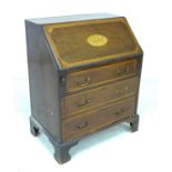 A small Victorian mahogany bureau, with decorative shell and satinwood inlays, three drawers, raised