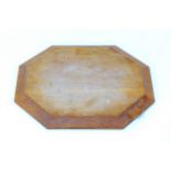 A Robert 'Mouseman' Thompson carved oak breadboard, of octagonal form with carved mouse signature,