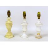 A group of three white carved alabaster table lamps, comprising a pair of urn form and another