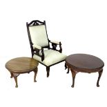 An early 20th century show frame upholstered armchair and two occasional tables, the chair with