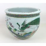 A Chinese porcelain Famille Verte fish bowl, decorated in Kangxi style with two peacocks amongst