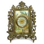 A 19th century brass framed mantel clock, with ivory surrounded painted with a garden scene, a/f, 17