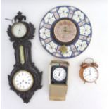 A group of four clocks, including a metal wood effect cased barometer with key, a chess stop