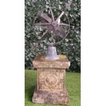 A copper armillary sphere on a stepped reconstituted stone pedestal, 100cm high.