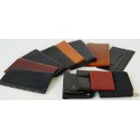 A black ostrich leather wallet by Dunhill, six further Dunhill wallets,