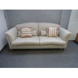 A modern double hump back sofa on tapering square beech supports, 220cm wide x 95cm high.