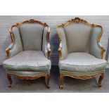 A pair of Louis XV style gilt framed tub back armchairs, with serpentine seats, on scroll supports,