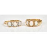 A gold ring, mounted with three oval opals and with two pairs of cushion shaped diamonds,