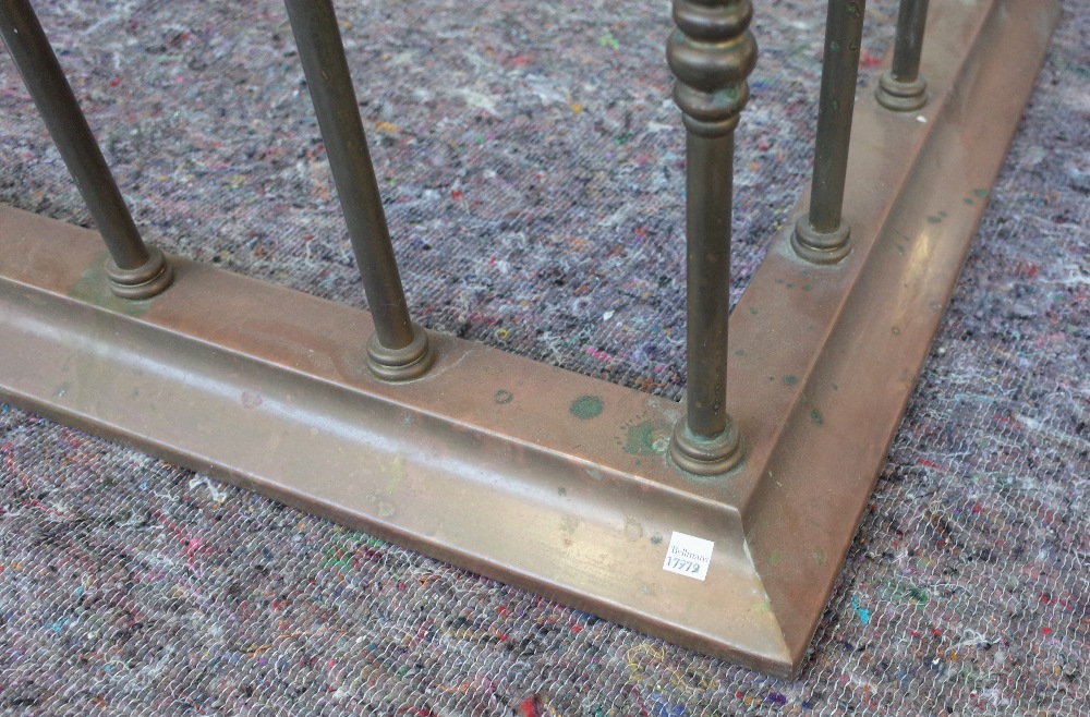 An early 20th century brass and cream upholstered club fender with sloped curb, - Image 8 of 11