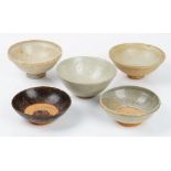 A group of five Asian monochrome pottery bowls,