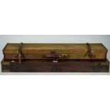 A mahogany and brass bound gun case (interior lacking) 84cm wide,