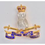 A 9ct two colour gold and enamelled Defence Services Staff College regimental brooch,