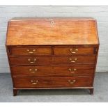 A George III mahogany bureau, the fitted interior over two short and two long graduated drawers,