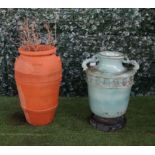 A terracotta oil jar with shell handles, 50cm diameter x 80cm high,