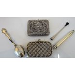 A rectangular filigree cigarette case, a rectangular lady's purse,