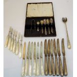 A set of six pairs of silver desert or fruit knives and forks, having mother-of-pearl handles,