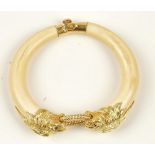 A Van Cleef & Arpels gold and ivory bangle, circa 1974, of twin section form,