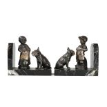 A pair of silver plated and marble book-ends, mounted with models of a child and a bulldog,