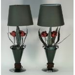 A pair of mid-20th century Italian tole peinte table lamps, modelled as flowers in a vase,