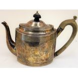 A George III silver teapot, of oval form, with engraved decoration between reeded bands,