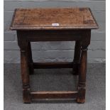 A 17th century oak joint stool, with moulded rectangular top, triangular carved friezes,