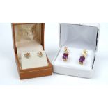 A pair of gold and amethyst single stone pendant earrings,