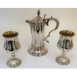 A plated wine flagon, with a matching pair of goblets, the flagon of Gothic design,