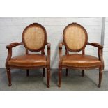 A pair of Louis XVI style brown leather upholstered carved beech framed open armchairs,